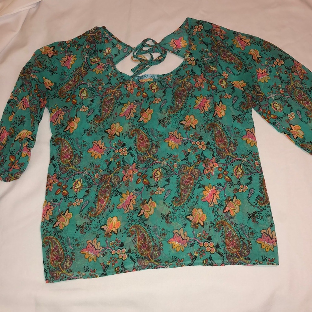 Blue floral print blouse.